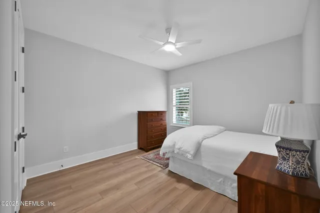 a view of a swimming pool with a table and chairs