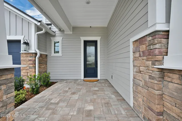 a spacious bedroom with a bed and a large window