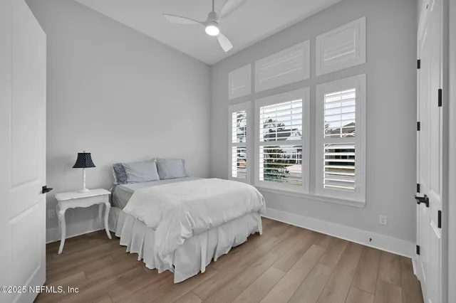 a living room with furniture and a dresser