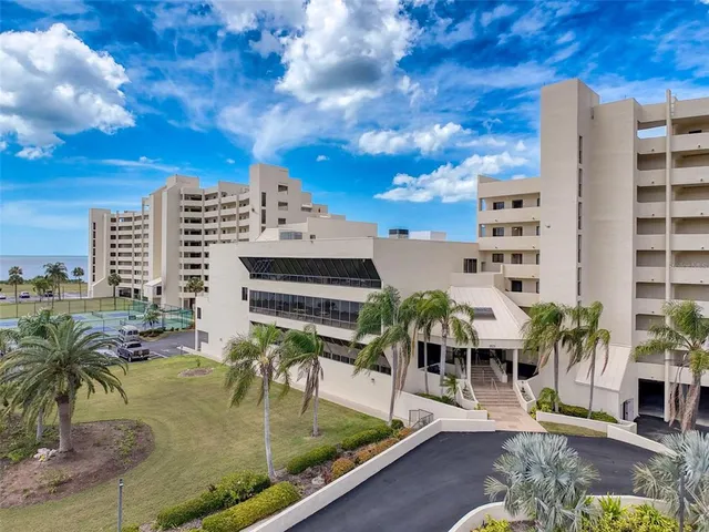 a kitchen with stainless steel appliances a stove a sink island and a refrigerator