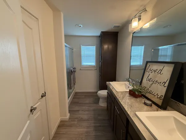 a bathroom with a glass shower door