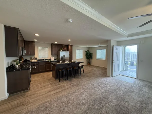 a kitchen with sink and cabinets