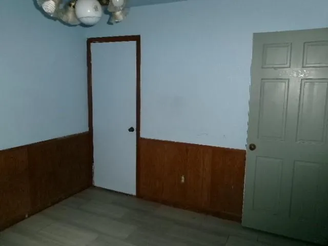 an empty room with wooden floor
