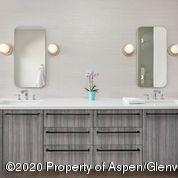 336 Allison Lane, Unit A Basalt, CO 81621 - Photo 13 of 18 a bathroom with a sink and a mirror