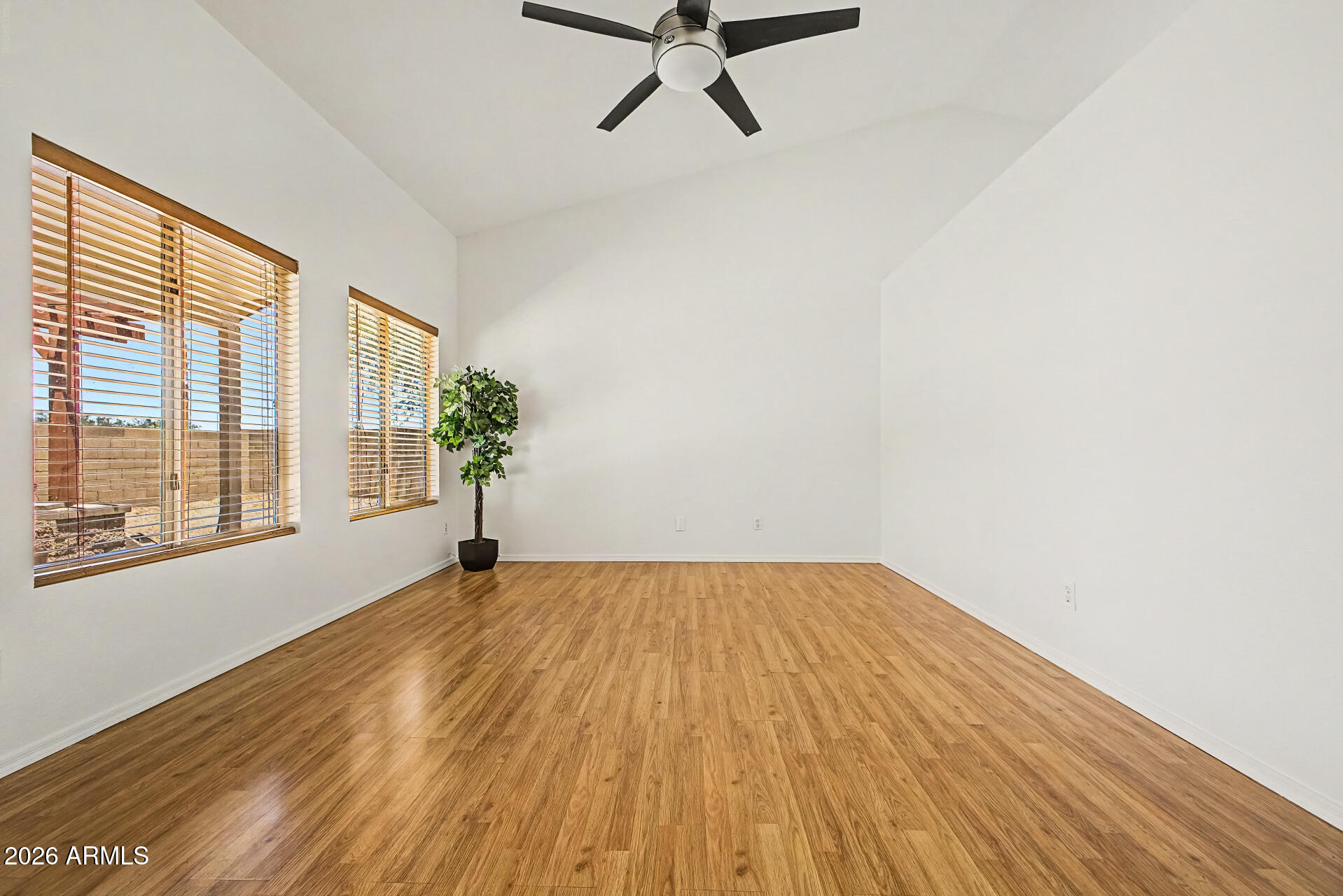 2762 North Ricardo Mesa, AZ 85215 - Photo 11 of 38 a view of a livingroom with wooden floor and a ceiling fan