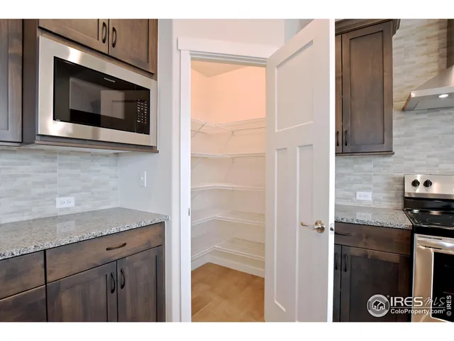 a kitchen with a sink and a microwave