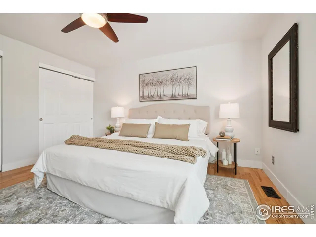 a bedroom with bed and window