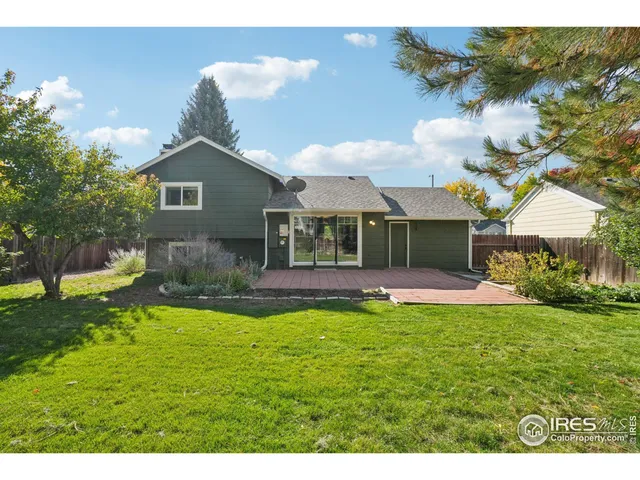 a view of a house with a yard porch and sitting area