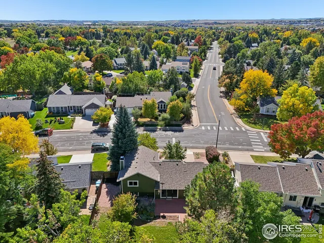 an aerial view of a house with a swimming pool