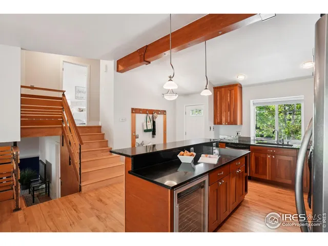 a kitchen that has a sink cabinets and a window