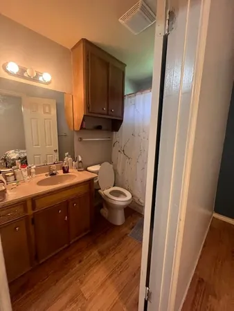 a bathroom with a double vanity sink and a mirror