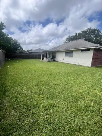 a backyard of a house with lots of green space