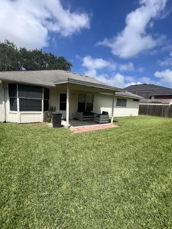 a front view of house with yard and seating
