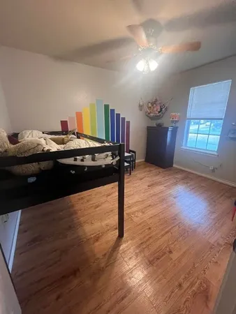 a living room with hard wood floors