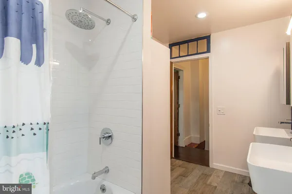a bathroom with a shower and a toilet