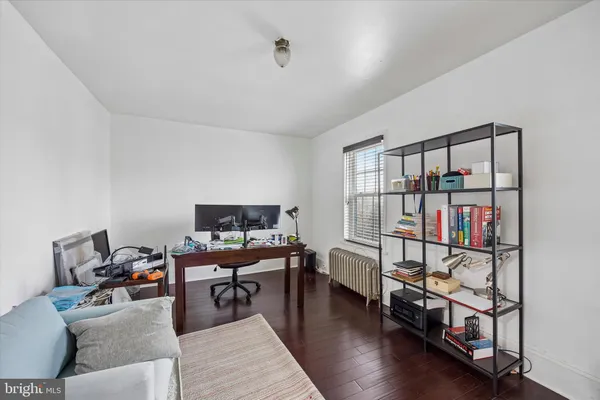 a reading room with furniture and book shelf