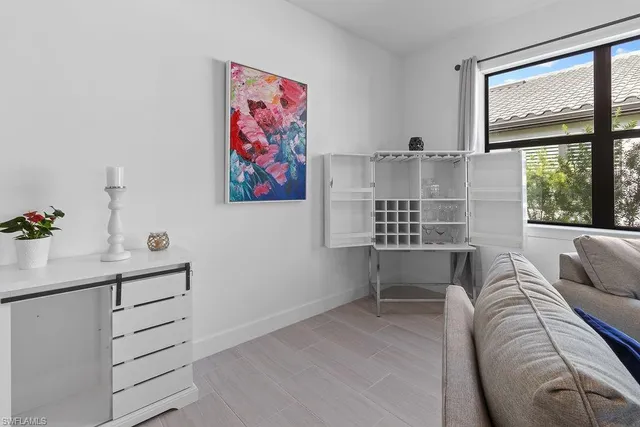 a view of workspace with furniture and window