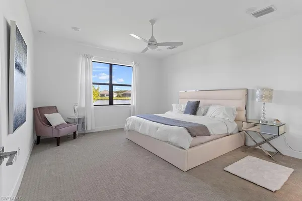 a bedroom with bed and window