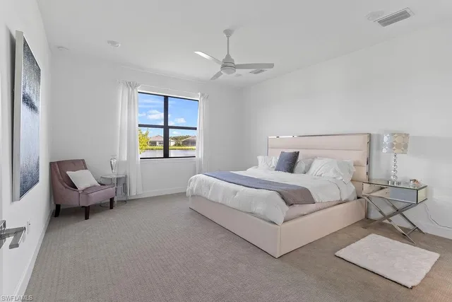 a bedroom with bed and window