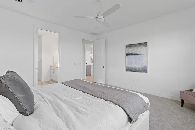 a bedroom with a bed and a couch