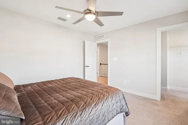 a bathroom with a double vanity sink toilet and shower