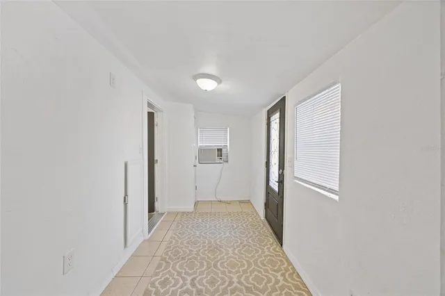 a view of a house with a yard and a garage