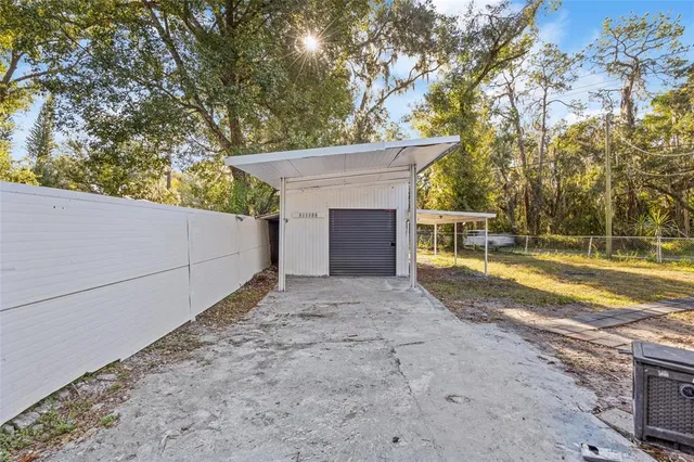 a house view with swimming pool in front of it