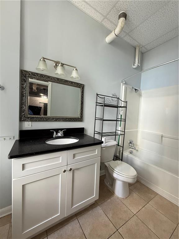 20 Marietta Street Northwest, Unit 10F Atlanta, GA 30303 - Photo 11 of 17 a bathroom with a toilet sink and mirror