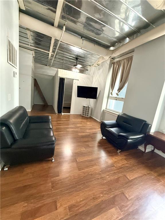 20 Marietta Street Northwest, Unit 10F Atlanta, GA 30303 - Photo 5 of 17 a living room with furniture and a fireplace