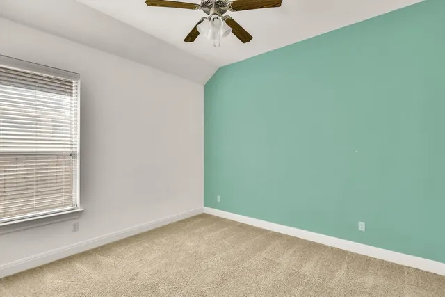 a view of a room that has a window in it