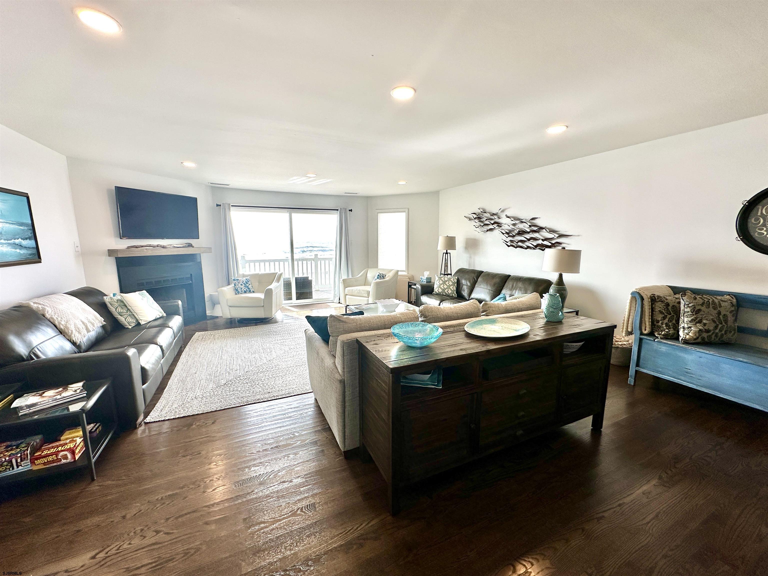 612 East Brigantine Avenue, Unit 612 Brigantine, NJ 08203 - Photo 11 of 29 a living room with a couch and a large window