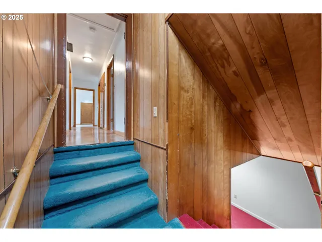 a view of an empty room with a fireplace