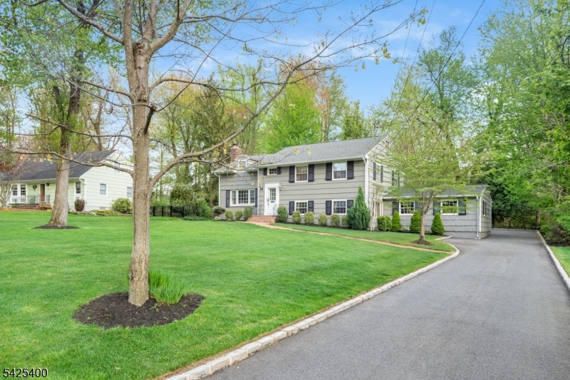28 Spring Ridge Drive Berkeley Heights, NJ 07922 - Photo 5 of 46 a front view of a house with a yard