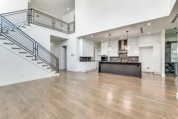 a view of kitchen with cabinets and wooden floor