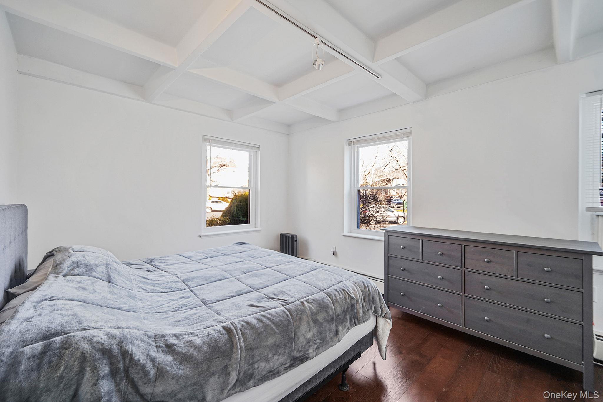 144-66 Village Road, Unit 75D Queens, NY 11435 - Photo 11 of 19 a bedroom with a bed and a window