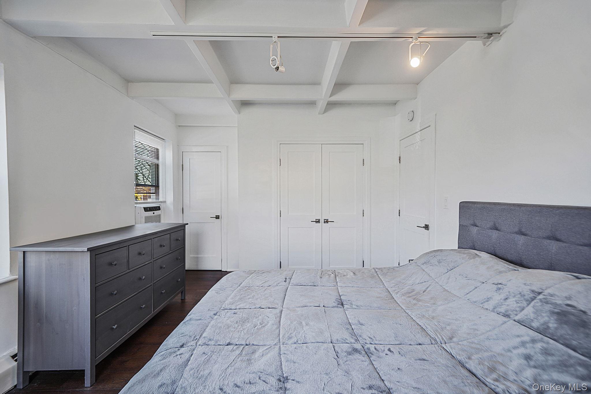 144-66 Village Road, Unit 75D Queens, NY 11435 - Photo 12 of 19 a spacious bathroom with a vanity and a mirror