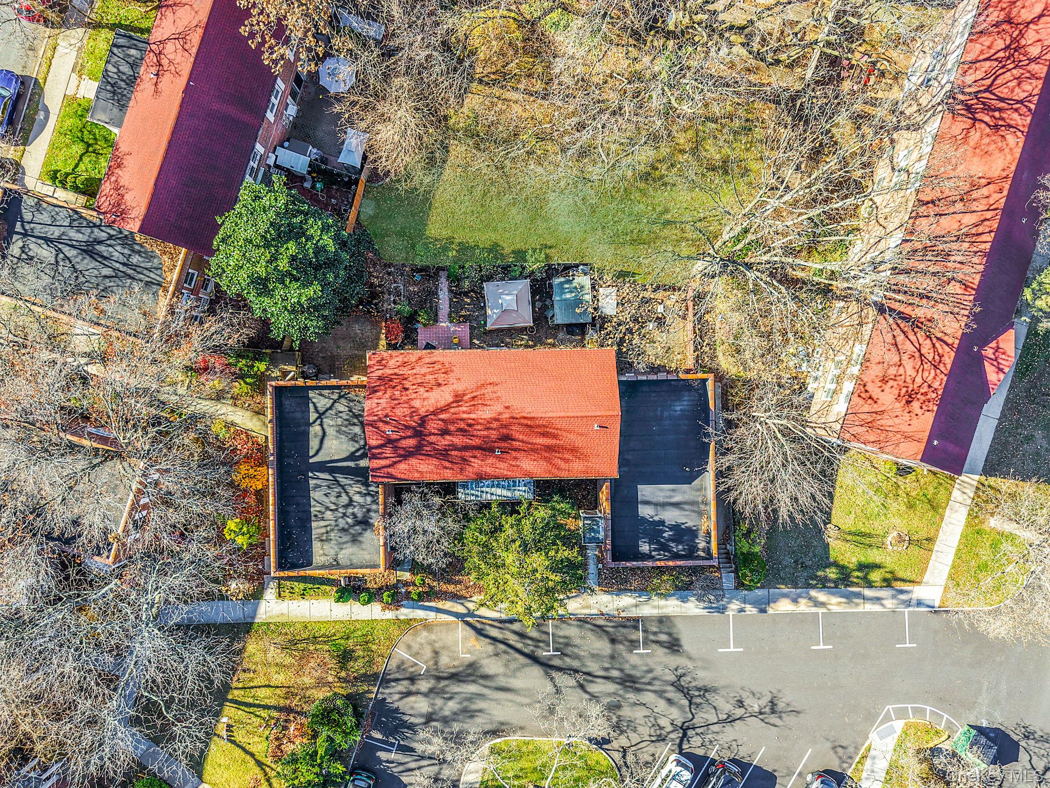 144-66 Village Road, Unit 75D Queens, NY 11435 - Photo 14 of 19 front view of a house with a yard