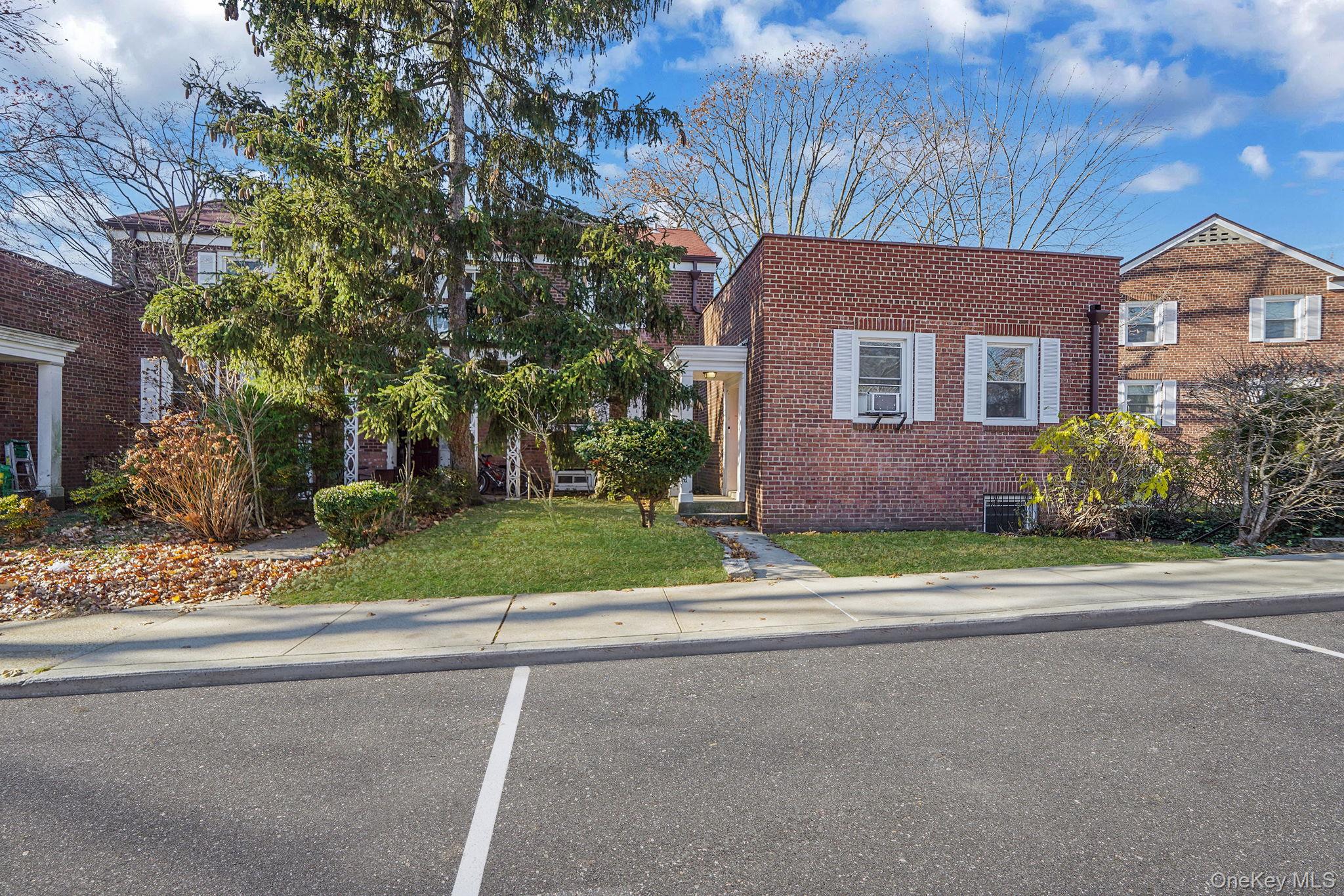 144-66 Village Road, Unit 75D Queens, NY 11435 - Photo 2 of 19 a brick house with a large windows
