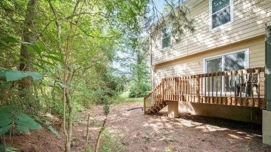 a view of backyard with a small cabin