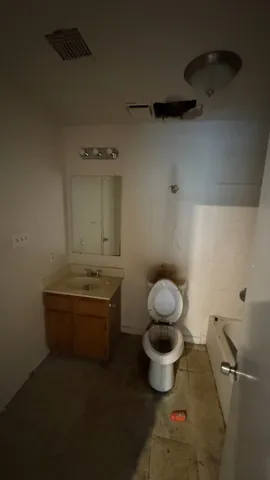 a bathroom with a toilet and a sink