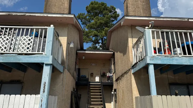 a view of a house with wooden stairs