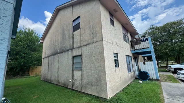a view of a back yard of the house