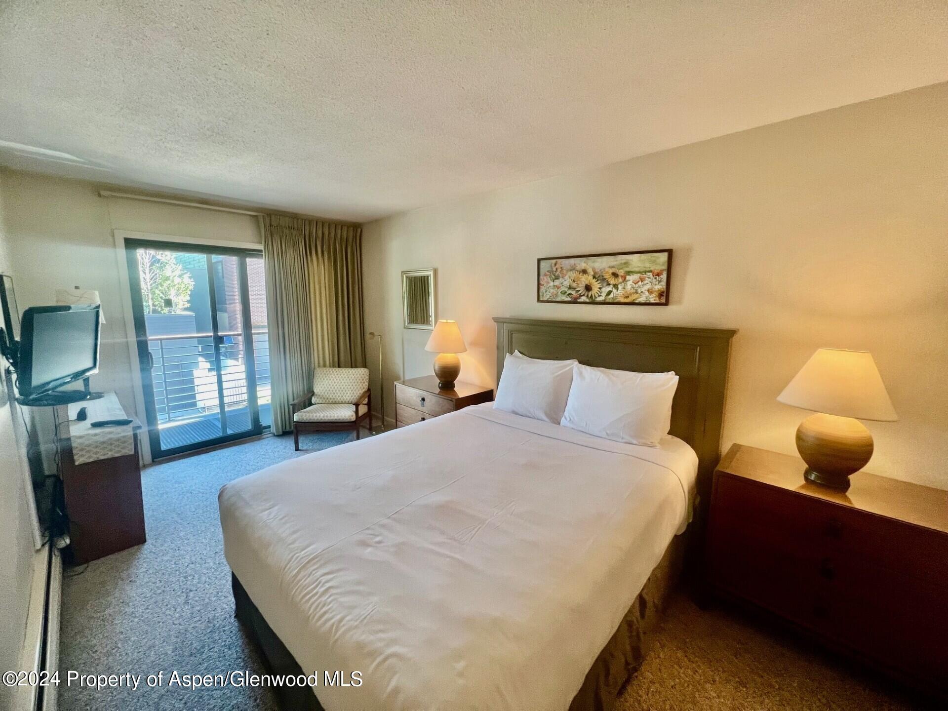 210 East Cooper Avenue, Unit 2D Aspen, CO 81611 - Photo 11 of 16 master bed deck