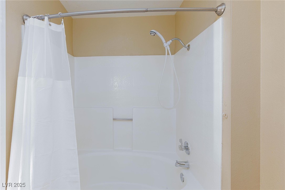 7300 West Pirates Cove Road, Unit 2038 Las Vegas, NV 89145 - Photo 15 of 26 Bathroom with shower / bathtub combination with curtain