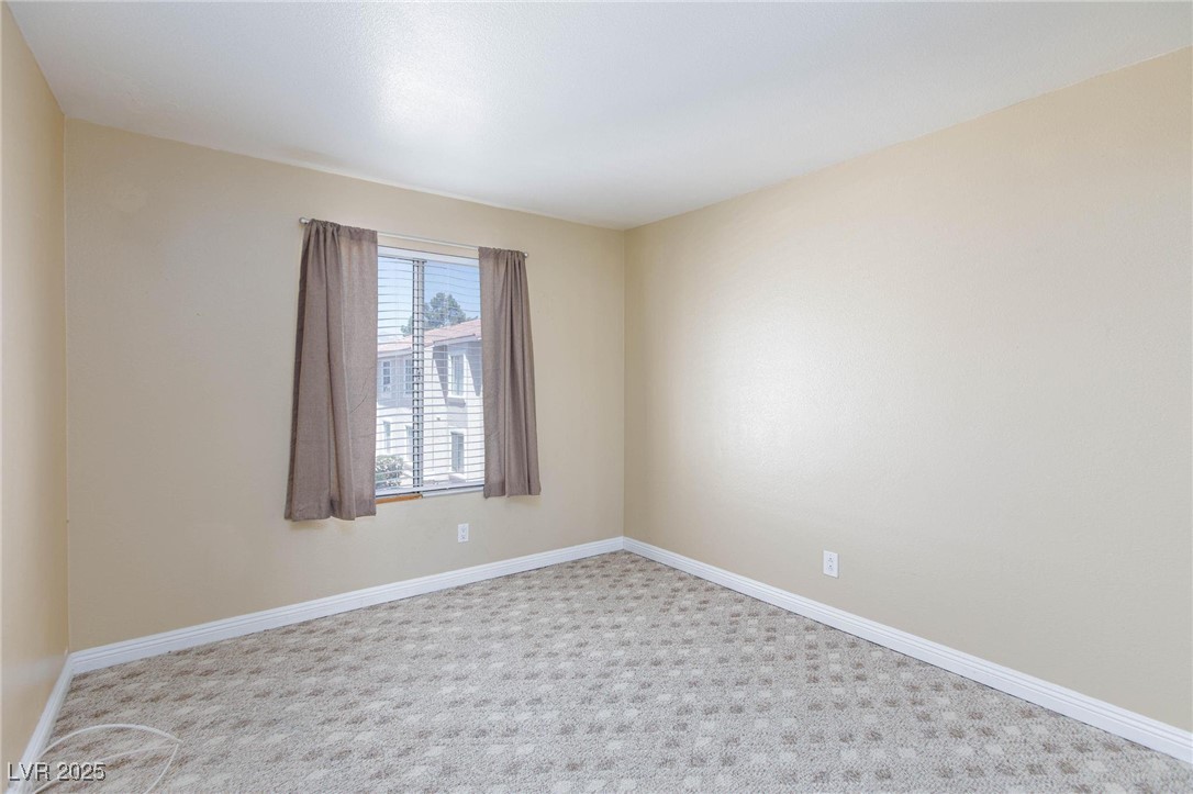 7300 West Pirates Cove Road, Unit 2038 Las Vegas, NV 89145 - Photo 16 of 26 Carpeted spare room with baseboards