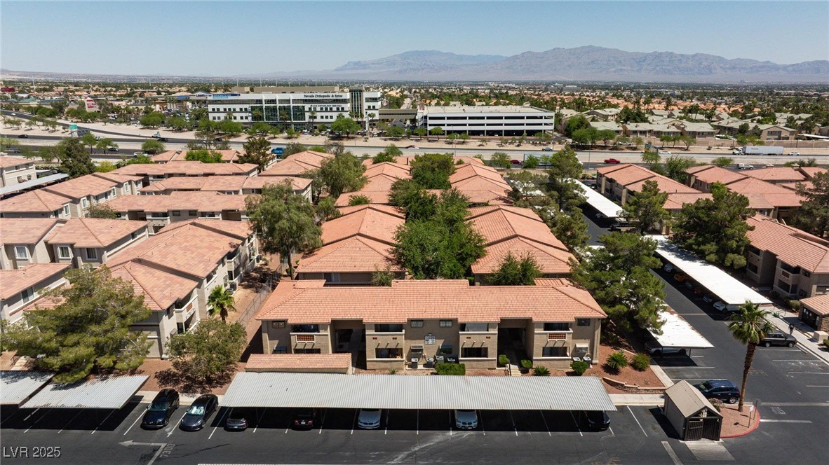 7300 West Pirates Cove Road, Unit 2038 Las Vegas, NV 89145 - Photo 21 of 26 Aerial view of residential area featuring mountains