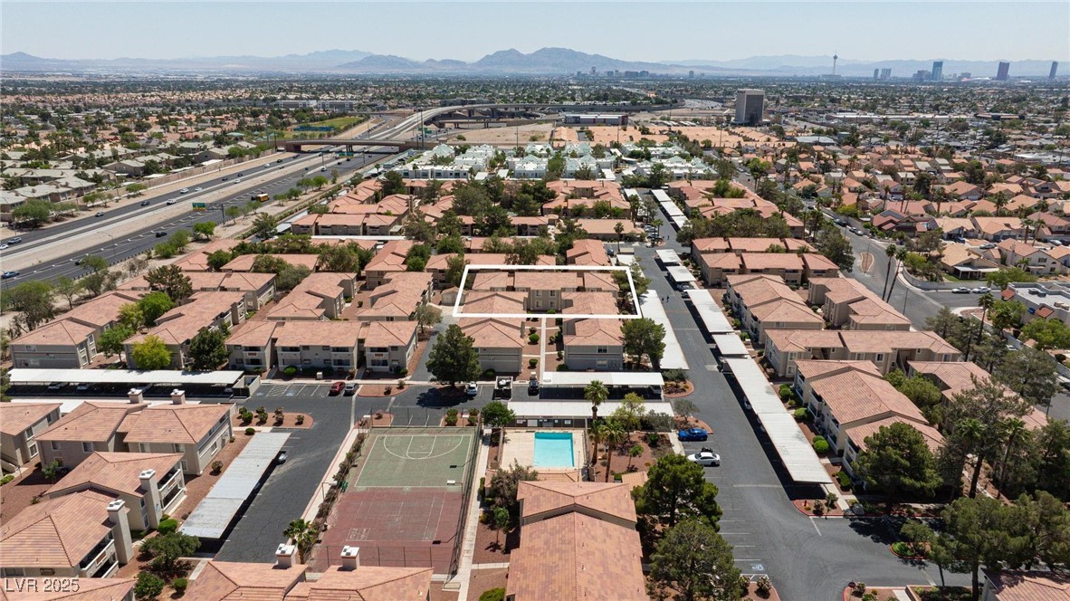 7300 West Pirates Cove Road, Unit 2038 Las Vegas, NV 89145 - Photo 24 of 26 Aerial view of residential area featuring mountains