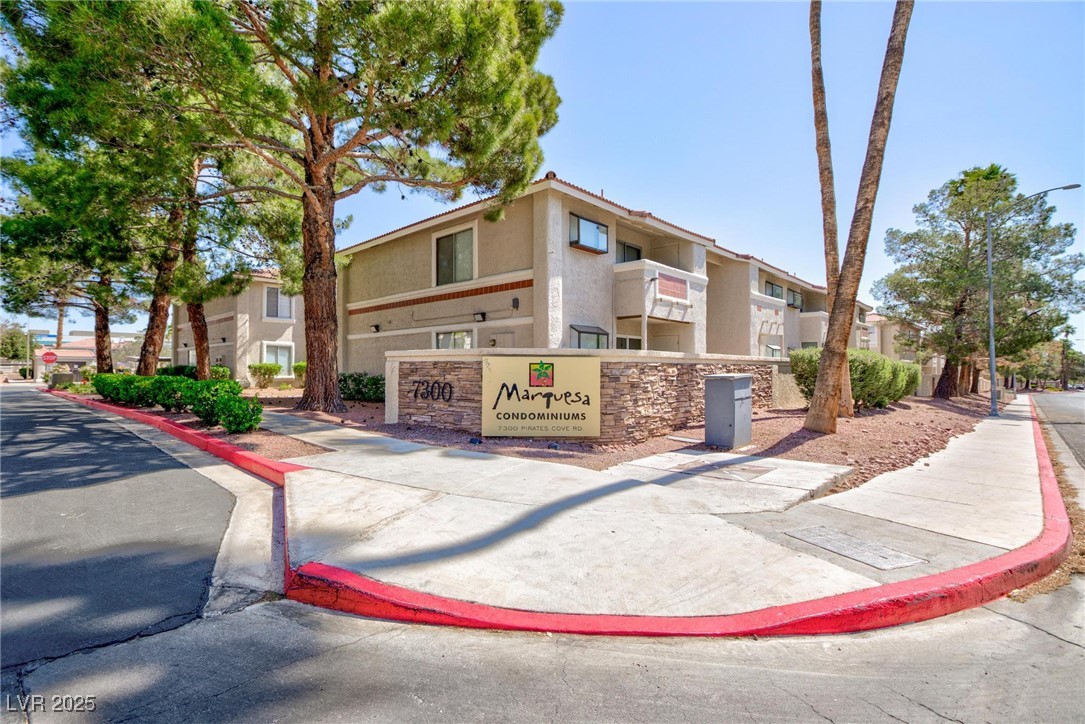 7300 West Pirates Cove Road, Unit 2038 Las Vegas, NV 89145 - Photo 25 of 26 View of building exterior with a residential view