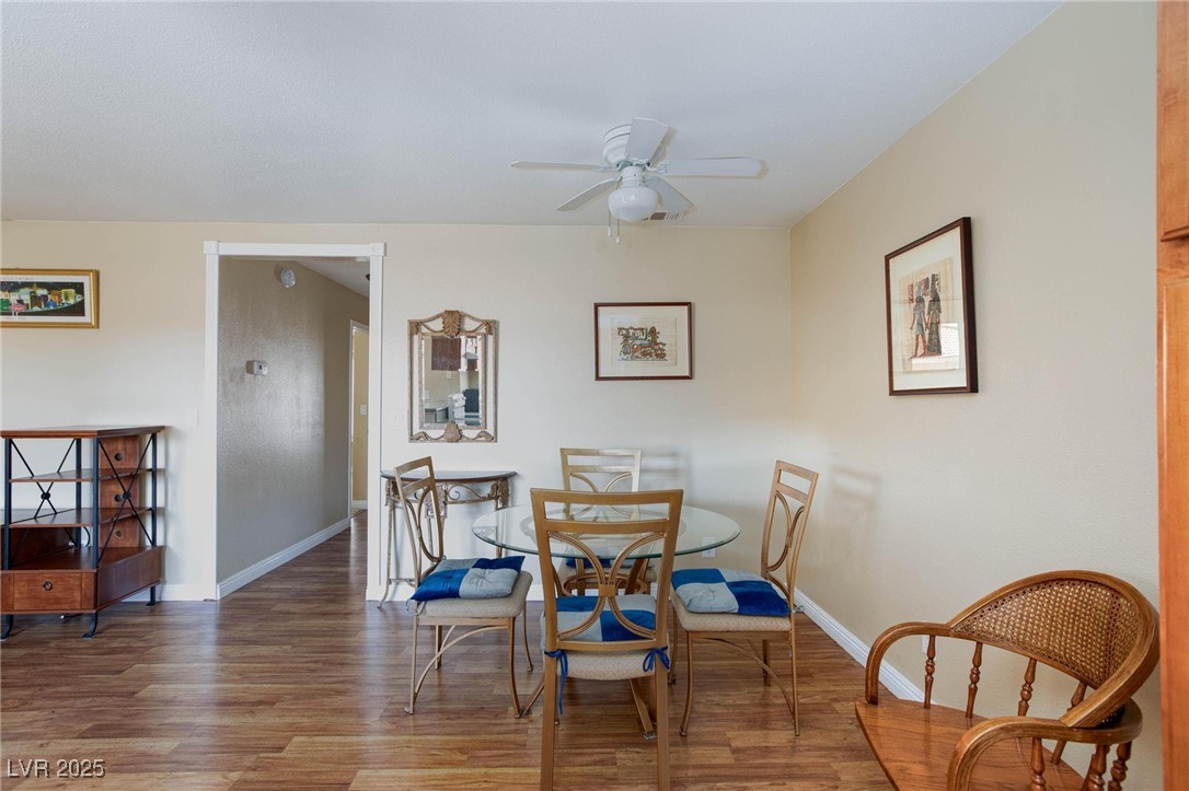7300 West Pirates Cove Road, Unit 2038 Las Vegas, NV 89145 - Photo 9 of 26 Dining room with light wood-style flooring and a ceiling fan