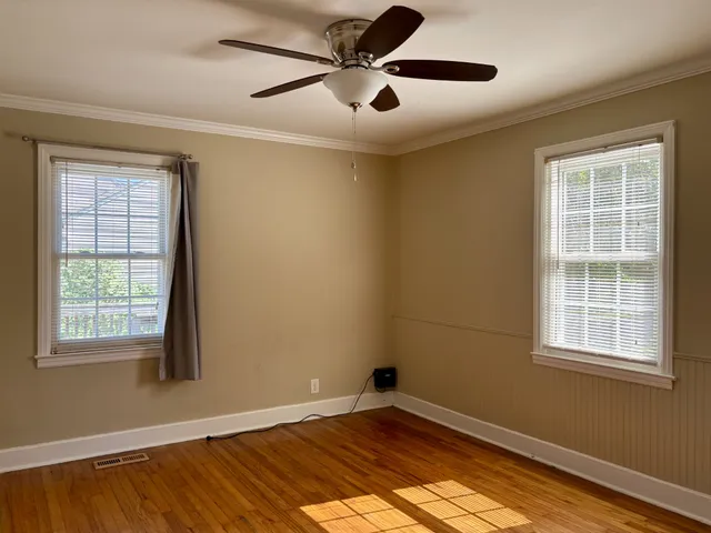 a view of empty room with windows